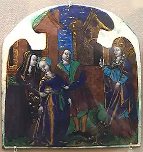 An enamel of Lupus of Troyes, a 5th-century bishop, healing a deaf woman. The old Cathedral is visible in the background.