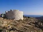 White circular tower made of marble