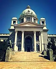 Stone steps leading to a porch with columns