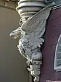 Close-up of the building's decorative gargoyles.