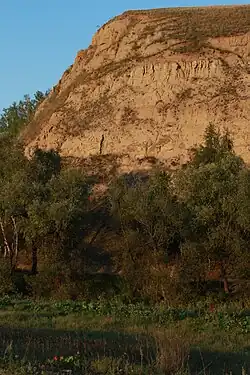 Bare cliff in Nizhneomsky District