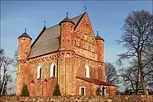 Large brick church, seen from street level