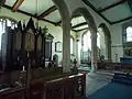 North chapel from the chancel, with organ and choir stalls