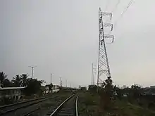 A segment of the transmission line along Tomas Claudio Street/PNR in Pandacan, Manila, with the lattice tower 154 at the foreground.