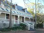 This nineteenth century dwelling, with its predominantly Victorian characteristics, forms an integral part of the architectural street scene of Voortrek Street and of the historic core of Swellendam.