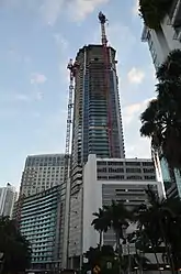 Panorama Tower under construction in October 2016 at about 60 floors with large multi-use pedestal (primarily parking) seen from Brickell Bay Drive.