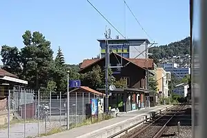 Two-story building next to side platform