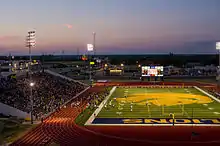 Commerce, Texas's Memorial Stadium, while using a green base, features a very large logo that colors much of the field gold.