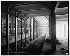 The Union Square station on the IRT line as seen when it was under construction. There are construction materials on the platform.