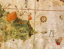 An old, hand-drawn map with a large compass rose on the right side and a coastline drawn on the left side with writing occupying the center