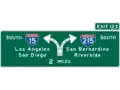 Directional sign for freeway split interchange