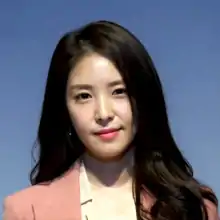 BoA with brown hair facing towards the camera