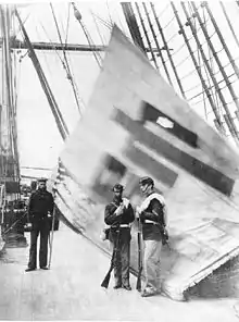 Captured Sujagi aboard USS Colorado. From right to left: U.S. Marine Corporal Charles Brown, U.S. Marine Private Hugh Purvis, and the sailor on the left is believed to be Cyrus Hayden (U.S. Navy). All three were awarded the Medal of Honor.