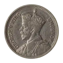 A coin featuring a crowned bust of King George V.