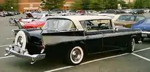 1958 Ambassador by Rambler four-door hardtop with full hub cap within its Continental tire cover