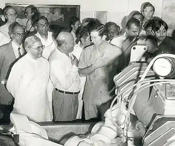 Manubhai Patel, Madhav Singh Solanki, H. M. Dalaya and Prince Charles in front of the butter manufacturing plant at Amul (1980).