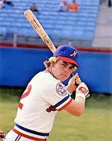 A baseball player in white