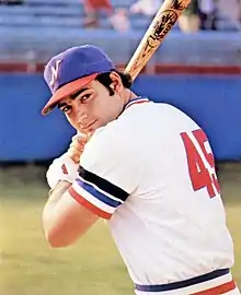 A baseball player in white