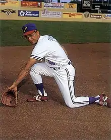 A baseball player in white