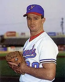 A baseball player in white