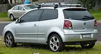  Rear-three-quarter view of a car fitted with a roof rack