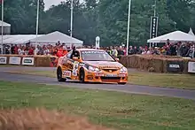 Matt Neal demonstrates a Team Dynamics BTC-T Honda Integra Type R at the 2005 Goodwood Festival of Speed.