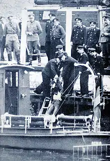 East German border guards retrieving the body of Günter Litfin from the River Spree