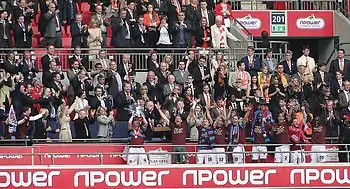 Kevin Nolan lifting a trophy