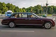 The Royal Standard flying on top of the Queen's car, during her state visit to Germany, 2015