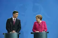 Sanchez speaking with Angela Merkel