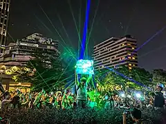 Protesters pointing their laser pointers to a newspaper mocking the police demonstration