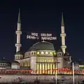 Night view of the mosque with Mahya lights welcoming the holy month of Ramadan