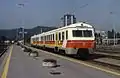 A SŽ 713/715 unit in legacy yellow-and-orange colour scheme