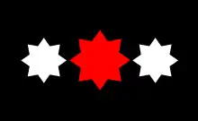 Two eight-sided white stars flank a central and larger eight-sided red star