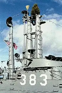 Masts and conning tower, with broom and tree, in March 2003