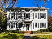 White two and a half story building