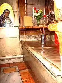 The slab marking the place where Jesus was laid to rest and resurrected in the Tomb or Edicule of the Church of the Holy Sepulchre in 2008.