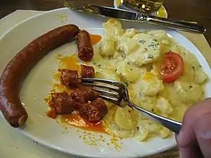 Swiss cuisine –  paprika sausage with potatoes at the Zeughauskeller, Zürich, Switzerland