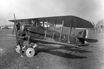 Eddie Rickenbacker with SPAD XIII (note the "Hat in the Ring" 94th Aero Squadron insignia), France, 1918