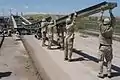 Soldiers (299 MRBC) steady the launch nose of a Medium Girder Bridge during erection over the Kazer River, Mosul, Iraq, 2003.