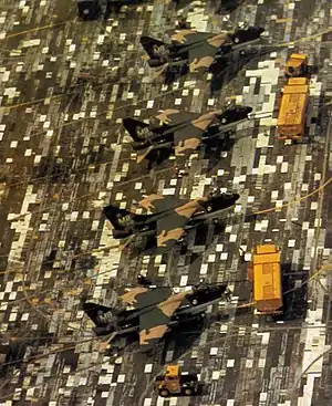 Disruptively camouflaged A-7D Corsairs on a disruptively painted concrete surface, Thailand, 1972