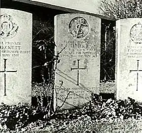 Three light-coloured grave stones, the centre one being dedicated to "R.A. Little"