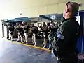 A Hellenic Navy SOF (special operations forces) instructor conducts small arms training with U.S. sailors aboard the HN training ship Aris