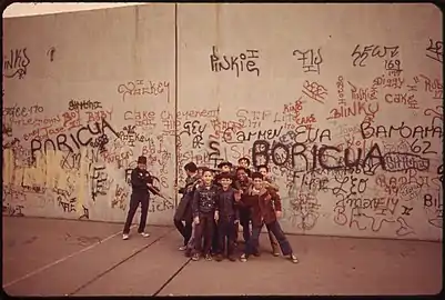 Children playing on sidewalk in 1973