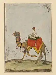  A painting of a man sitting on a camel and playing the drums