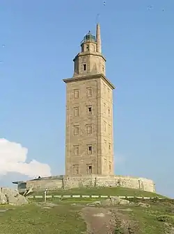 A stone tower with a square base topped by two octagonal sections.