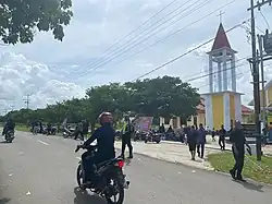 Scene of a street in Tiakur, afront a church