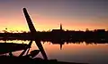 During twilight over the town bay and the silhouette.