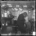 Adolf Henrik Lindstrøm in the kitchen at Framheim, Amundsen's base in Antarctica during the expedition to the South Pole, 1910–1913.