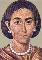 The right figure, with a hair style peculiar to Egypt